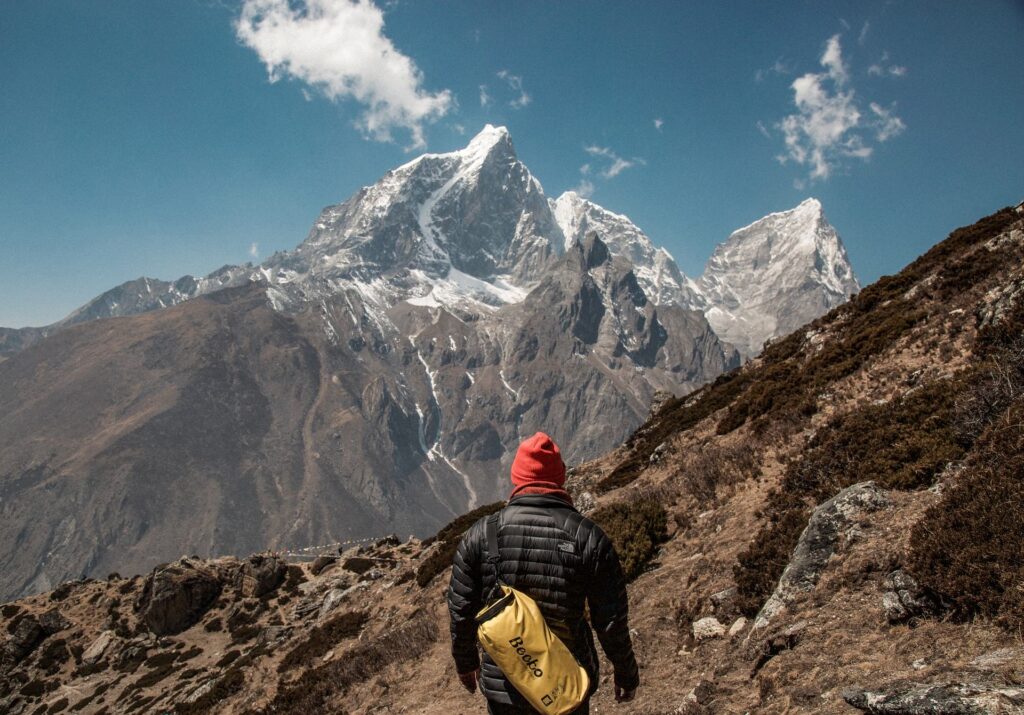 man trekking mountains in Nepal