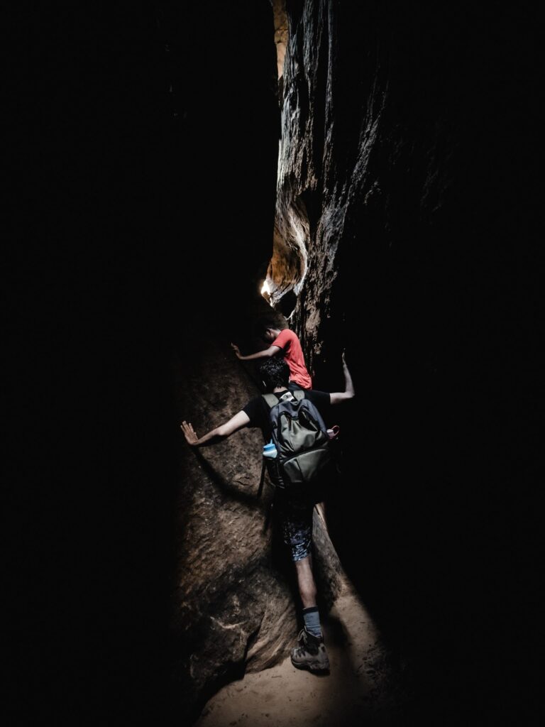 People climbing in Red River Gorge cave